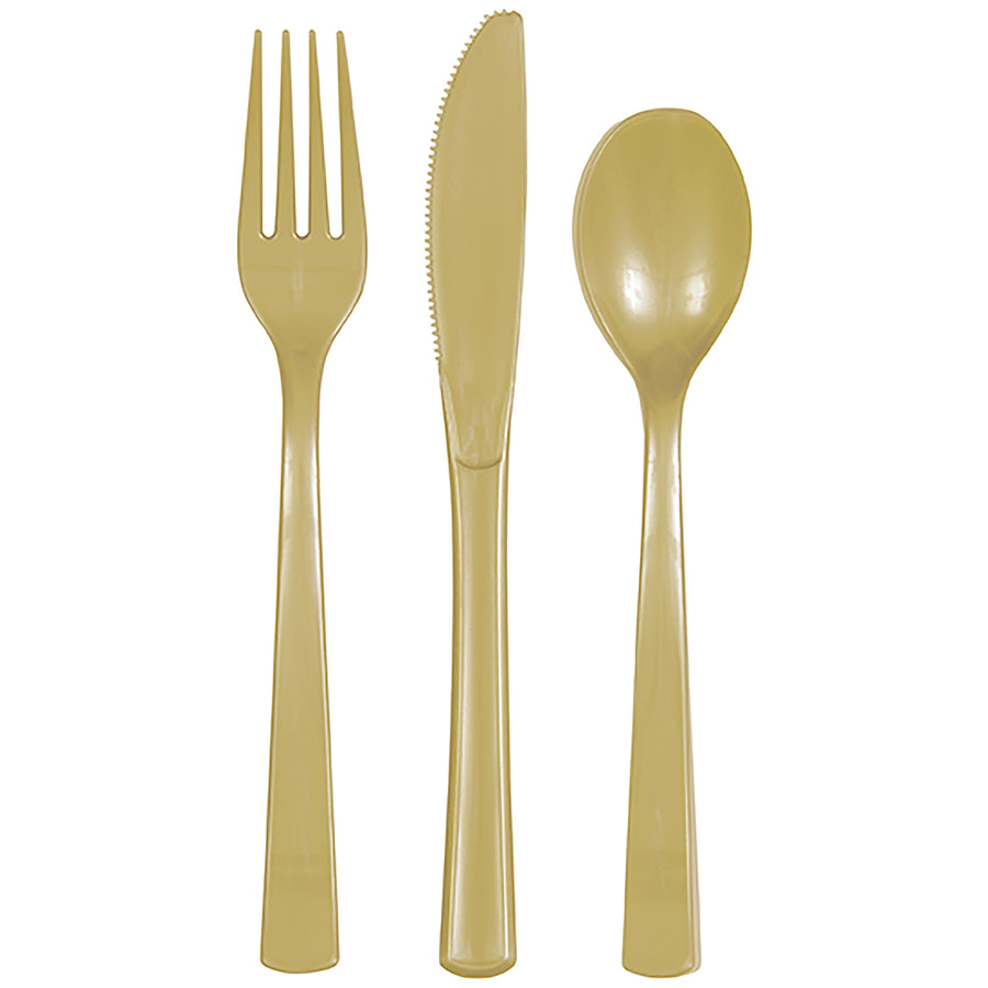 Three gold disposable plastic utensils - fork, serrated knife and spoon on white background.
