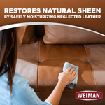 Close-up of a person buffing a brown leather sofa cushion with a cloth and Weiman logo, with headline about restoring natural sheen.