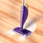 Close-up illustration of a purple Swiffer WetJet mop head on a wood floor with lighted spray effect
