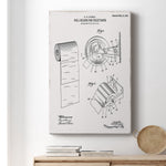 Framed gallery-wrapped canvas with an antique-style toilet paper holder patent print hanging above stacked books on a wooden surface.