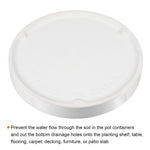 Underside view of a white round ceramic saucer showing recessed notches and embossed 'Made in China'