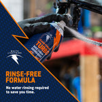 Hand-held can spraying White Lightning Turbo degreaser on a bike chain with overlay text 'Rinse-Free Formula'