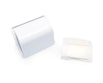 White plastic pop-up toothbrush/dispenser housing beside an adhesive mounting pad on white background