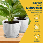 Two white speckled ribbed plastic planters on a wood surface with green houseplants and yellow panel text promoting stylish, lightweight design