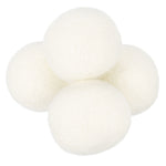 Cluster of four white wool dryer balls on a white background, showing felted texture.