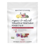 White Whitney Farms bag of organic tomato & vegetable food with floral and tomato artwork and 7-6-9 label