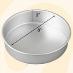 Angled view of a silver 8-inch round aluminum cake pan with arrows indicating 8" diameter and 2" depth