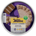 Top-down view of Wilton branded packaging showing a frosted cake with a slice removed inside a round aluminum pan label.