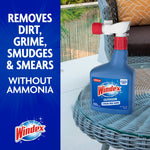 Windex Outdoor bottle placed on wicker patio table next to text claiming it removes dirt, grime, smudges & smears without ammonia