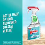 Windex with Vinegar spray bottle on a sandy background with text about bottle made from recovered coastal plastic