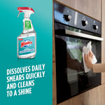 Windex with Vinegar spray bottle shown beside an oven being wiped, product claim text visible