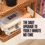 Wipe That Tush packs arranged on a wicker shelf beside a toilet with a text callout about a daily upgrade to me-time.