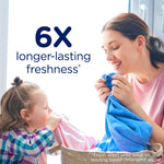 Lifestyle image of a smiling woman and child enjoying freshly laundered fabric with 6X freshness text.