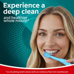 Smiling woman brushing with a Colgate 360 Vibrate toothbrush in a lifestyle image with product claim text
