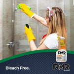Person wearing yellow gloves cleaning a glass shower with a small RMR Xtreme soap scum spray bottle inset