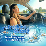Woman driving with eyes closed enjoying a car interior; graphic waves and text promote Little Pup Refreshing Ocean Splash scent