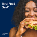 Woman biting into a sandwich against a dark blue backdrop with text stating “Best Food Seal” for Fixodent product messaging.