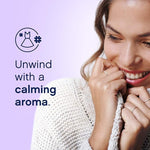Woman holding a knit sweater to her face beside text 'Unwind with a calming aroma' on a soft purple background.