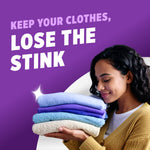Woman holding and smelling a stack of freshly folded towels beside text ‘Keep your clothes, lose the stink’