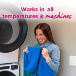 Smiling woman holding a blue garment in a laundry room with text about working in all machines