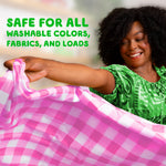 Smiling woman holding a pink checkered sheet with overlay text about safety for washable colors and fabrics