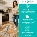 Lifestyle image of a woman using a True & Tidy spray mop on a kitchen floor alongside brand value and warranty text