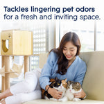 Lifestyle image of a woman on a sofa holding two cats with headline about tackling lingering pet odors