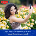 Woman taking a selfie among yellow rose bushes with BioAdvanced logo and banner 'Get your flowers photo ready!'