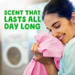 Woman smelling freshly laundered pink fabric with text proclaiming long‑lasting scent