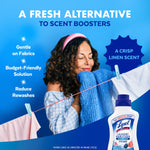 Woman smelling a freshly laundered sweater on a clothesline with Lysol Laundry Sanitizer bottle and text.