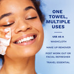 Smiling woman using a Q-tips disposable face towel with text listing multiple uses on a blue background