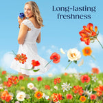 Woman in white dress holding a Downy Citrea bottle over a meadow of orange and white flowers and “Long-lasting freshness” text
