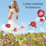 Woman in a white dress holding a Downy bottle over a meadow of pink flowers with text reading 'Long-lasting freshness'