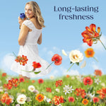 Woman in a white dress holding a Downy Citrea bottle over a field of illustrated flowers with the words 'Long-lasting freshness'.