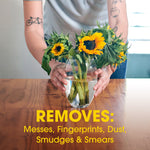 Hands arranging a vase of sunflowers on a wooden table with overlay text listing messes removed, promotional product context.