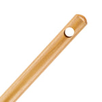 Angled close-up of the top end of a polished wooden broom handle showing a round hanging hole