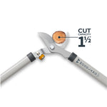 Close-up of lopper blades cutting a small branch with graphic callout showing 1½" cut capacity and Woodland branding on handle