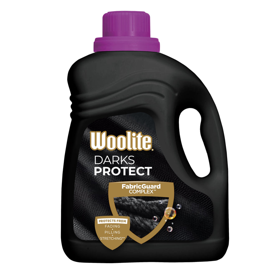 Black Woolite Darks Protect liquid detergent bottle with purple cap and FabricGuard shield label on white background