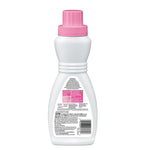 Rear view of a white Woolite bottle with a pink cap showing back label text and barcode.