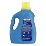 Rear view of blue Xtra detergent bottle showing directions, caution panel and commitment icons on label