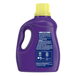 Back view of a purple Xtra detergent bottle showing the handle, directions panel and ingredient text
