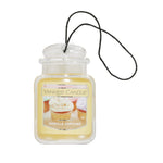 Clear jar-shaped Yankee Candle Car Jar air freshener with yellow vanilla cupcake label and black hanging string