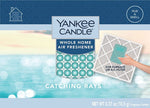 Yankee Candle blue-themed Catching Rays whole home air freshener packaging with product window and ocean background.