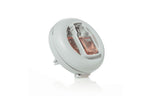 Angled product shot of a circular Yankee Candle vent clip with visible pink fragrance vial
