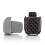 Yankee Candle Sidekick visor clip disassembled into cap and vented refill cartridge on white surface