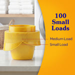 Yellow measuring cap on a counter with overlay text ‘100 Small Loads’ and guide marks for medium and small loads