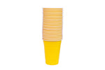 Stack of yellow disposable plastic party cups with white rims on a white background