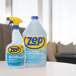 Styled scene with a Zep gallon and a filled Zep spray bottle placed on a table in a bright living room setting