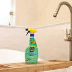 Zep Home Pro foaming bathroom cleaner bottle placed on a wooden bath tray near a bathtub faucet