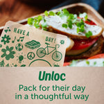 Close-up of a decorated Ziploc recyclable paper bag holding a sandwich, with blurred sandwich details in the background.